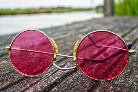 round sunglasses with pink lenses and gold frames